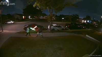 An epic lightsaber battle just happened in front of my house.