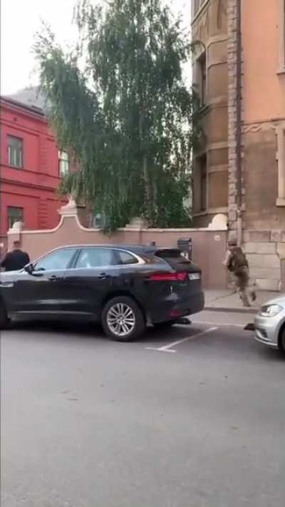 Latvian soldiers doing military excercise in the middle of a city.??