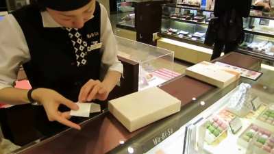 She said "omatase itashimashita" means "sorry for the delay" or "thanks for waiting"