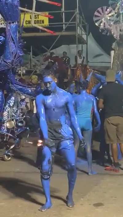 Being a fire breathing blue devil for carnival.