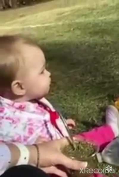 Baby tries herbal tea for the first time