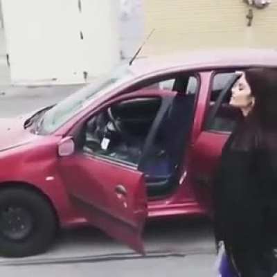 Girls get out of car going down hill for no reason..