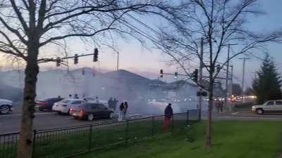 Idiots drifting in the middle of a busy intersection