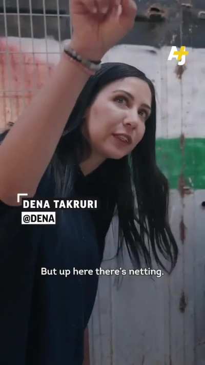 "The sky is garbage, the stones are like rain, I don't feel safe here" Hebron, Palestine. Palestinian marketplace covered in nets to protect from settler harassment
