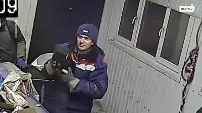 Guy sorting garbage saves a cat that was sealed in a bag and thrown away