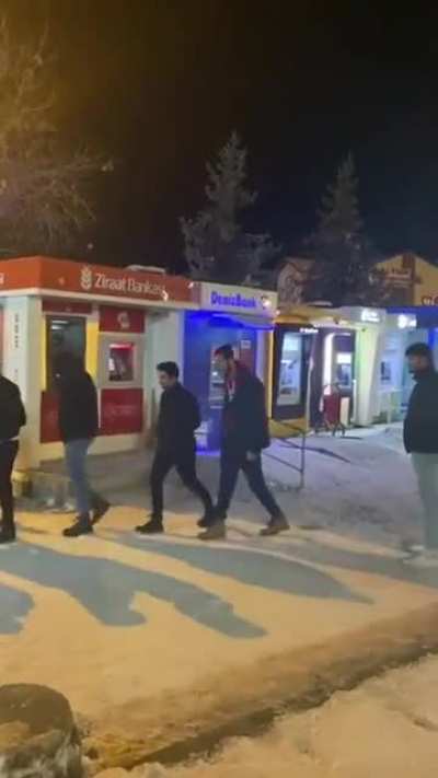 Dude(s) waiting in an ATM lime