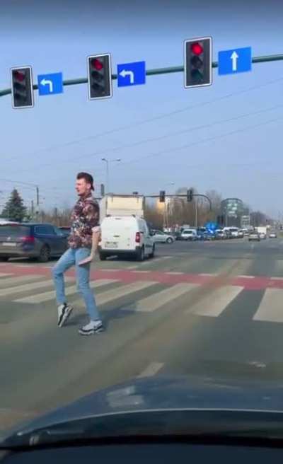 This man’s way of passing the time at a red light