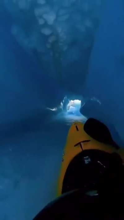 ? A guy kayaking down an ice river