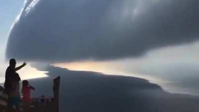 ? A stunning roll cloud moving over Lake Michigan recorded by Ken Temple.