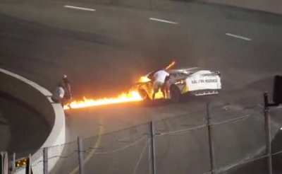 Dad rushes to save his son from burning car