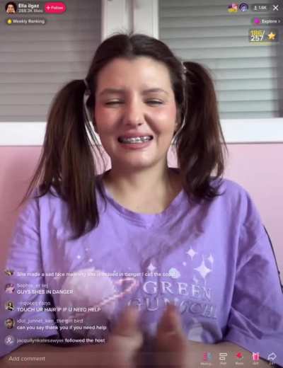 Woman dressed age inappropriately clapping while being scared and awkward.