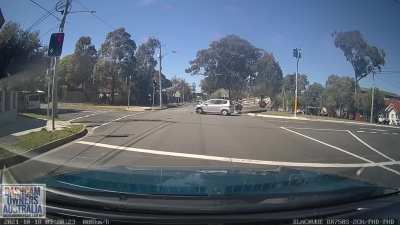 Car running red light gets t boned and flips over