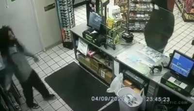 Cashier makes himself ready after seeing a suspicious guy outside his shop.