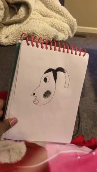 Daughter draws her mother’s face, and doesn’t know why her dad is laughing.