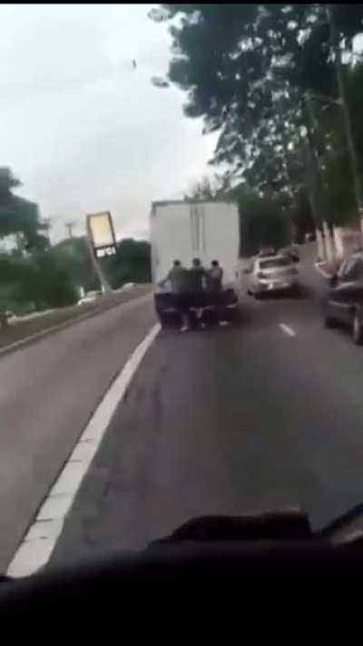 WCGW being towed behind a truck on skateboards