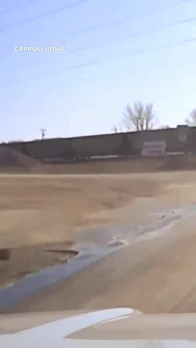 Cop clings to hood of car of fleeing suspect
