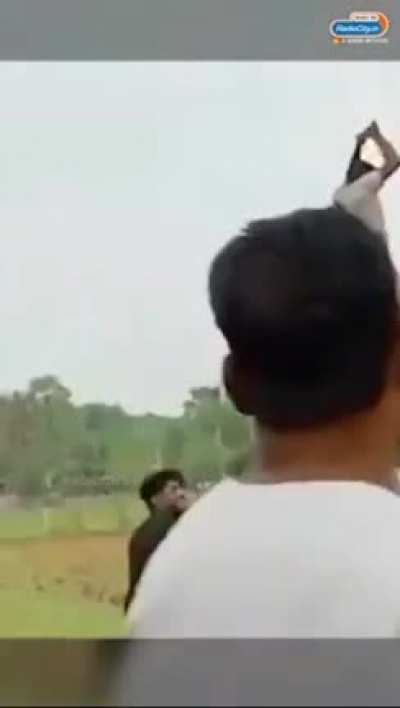 Flying a huge kite.