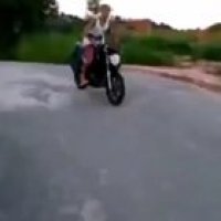 Doing a wheelie with ur bro