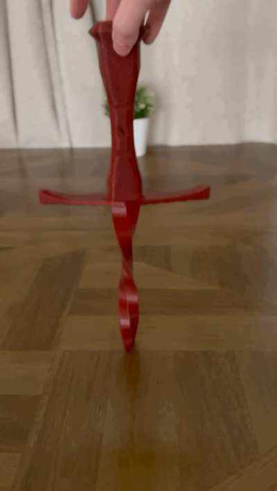 I designed / 3d printed a collapsible sword and inadvertently made an illusion with it.
