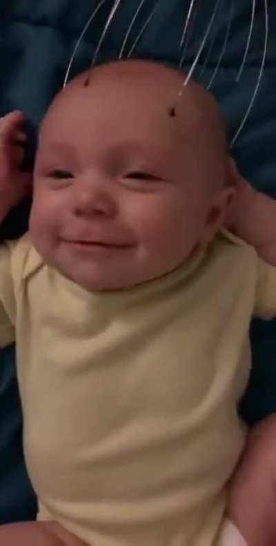 This baby loves to get his head massaged...