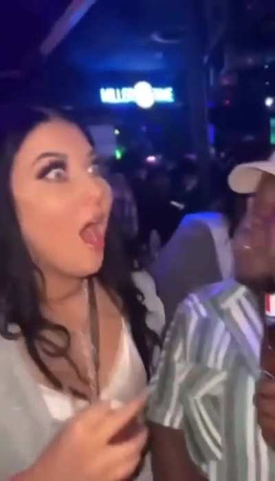 To spit her drink on a stranger