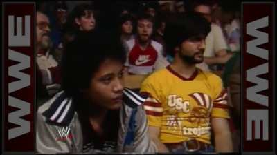 An 11 year old Dwayne "The Rock" Johnson sitting in the crowd watching his father about to wrestle, 1984.