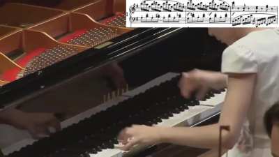 11 year old girl Alexandra Dovgan playing a fast pace piano concerto with crystal clear clarity and zero to no mistakes.