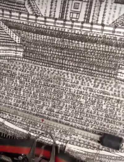 Guy creates sketch with a typewriter