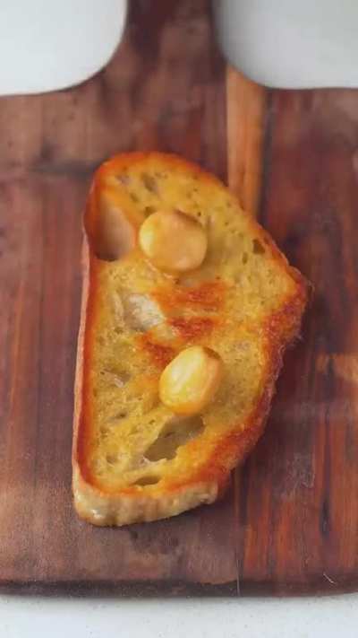 Making garlic caprese burrata toast