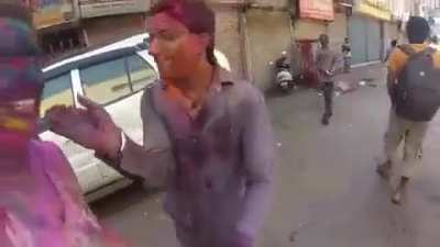 Random Creepy guys "hugs" his wife on camera in the name of holi festival