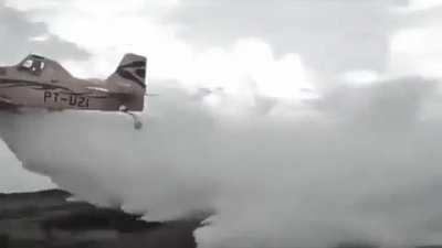 Wing collapse on a crop dusting plane flying over a field 2021