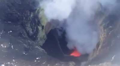 ? Flying over an active volcano in Alaska, United States