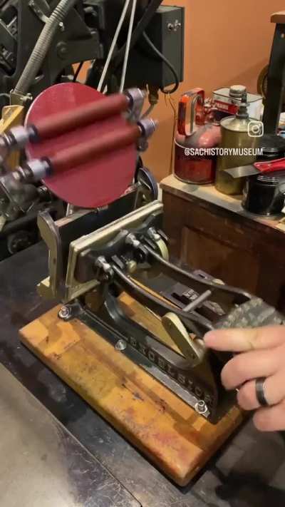 An antique letterpress prints a modern message