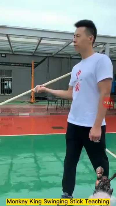 Wushu teacher demonstrates the speed of The monkey king swing stick