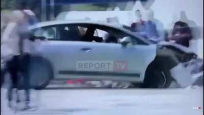 Albanian citizen surprises terrorist with a dropkick through the window!