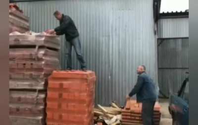 Passing your co-worker some bricks
