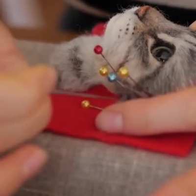 Hyper realistic cat head out of felted wool