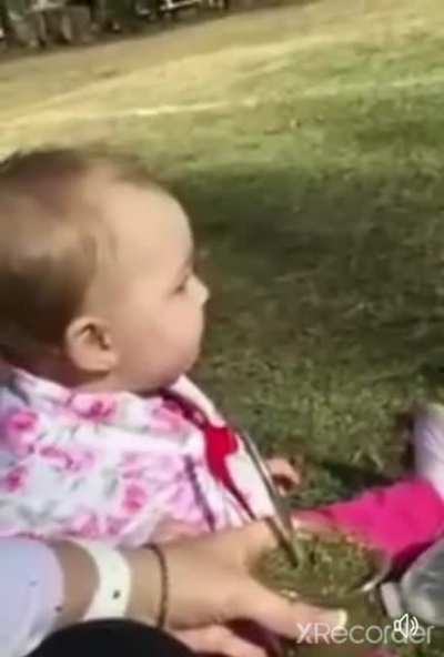 Baby tries herbal tea for the first time