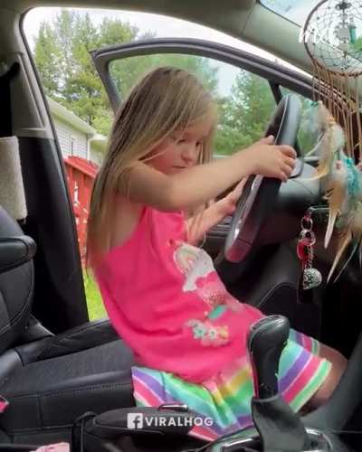 Mother leaves her little girl unattended in car, she throws the car in reverse, and records herself driving ?
