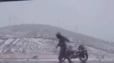 This cool guy dancing with the dog while on the snow. So Fun to watch!