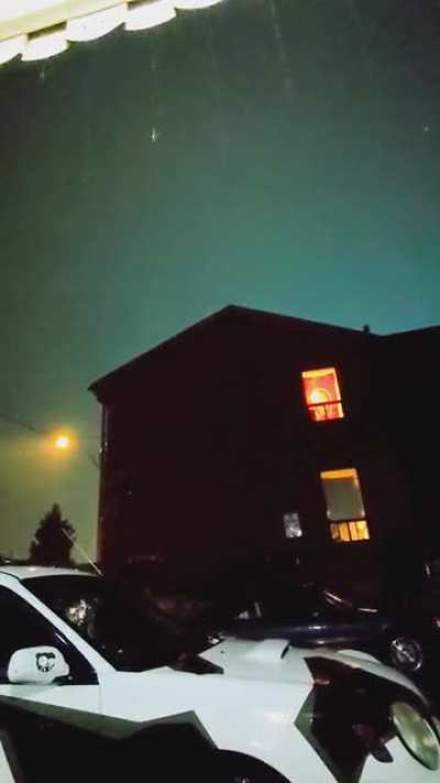 Sky glows green after lightning strike during Southern Ontario thunderstorm.