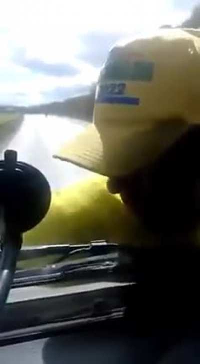 Bolsonaro’s supporter grabs truck to stop it. Driver doesn't care and takes him for a ride.