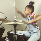 9 year old drummer Nandi Bushell rocks QOTSA