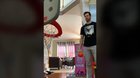 Dad gets good at his daughters basketball toy.