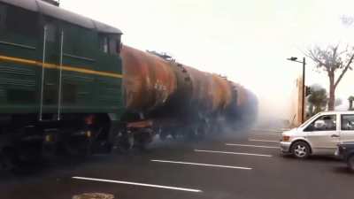 Train in Azerbaijani crossing a 7-lane highway