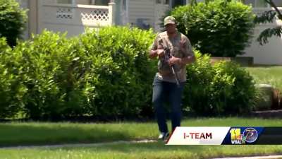 Man walks around with assault rifle at school bus top
