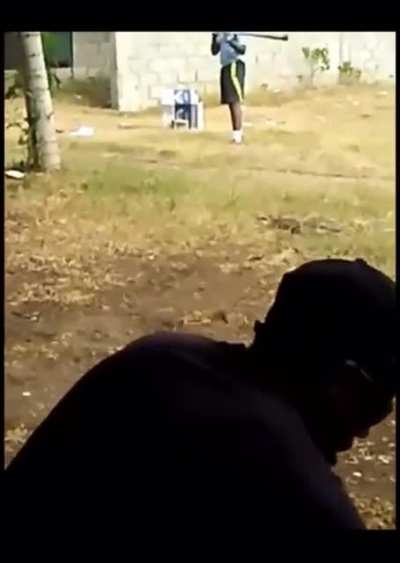 kid in the Dominican Republic is batting bottle caps off a slingshot