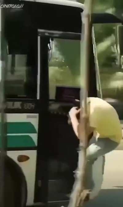 Riding on the outside of the bus