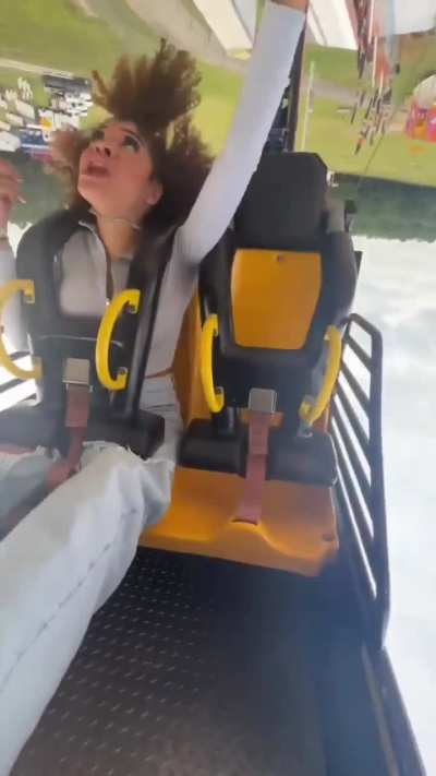 To use her phone while on a rollercoaster