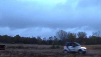 Pulling a Smart car out of the mud